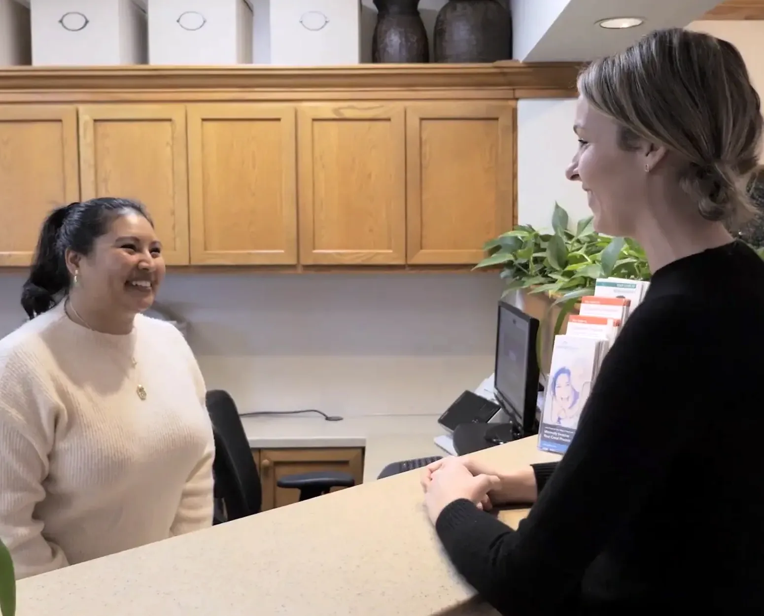 Front office team welcoming a patient